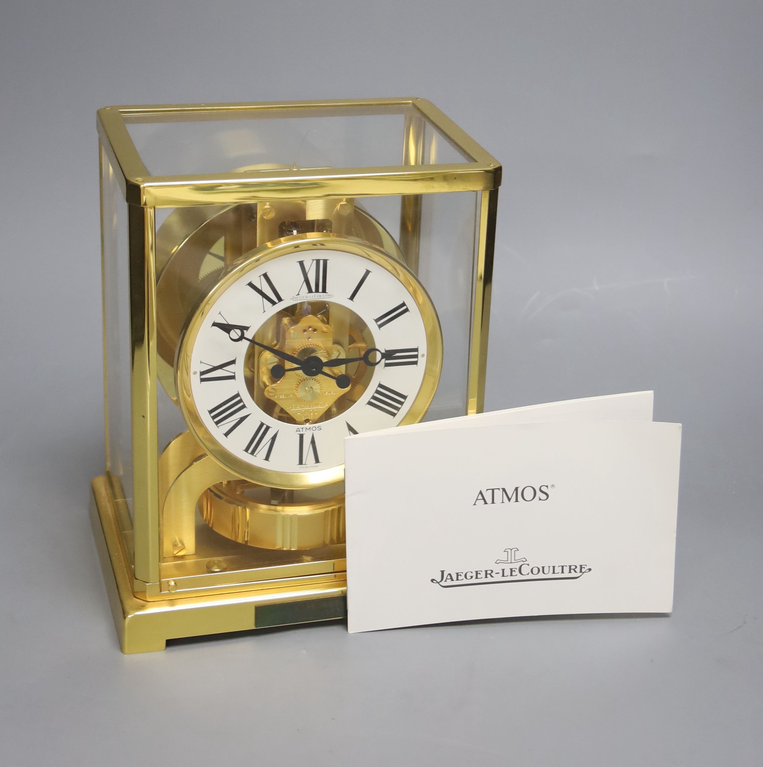 A Jaeger le Coultre Atmos mantel clock, with white enamelled Roman chapter ring, in gilt-brass panelled case, height 22.5cm